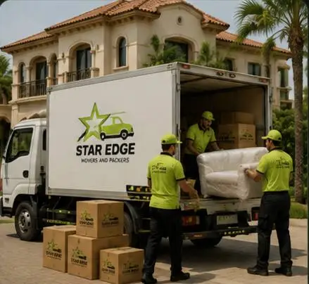 Star Edge crew loading a wrapped sofa into a branded truck at a Dubai villa